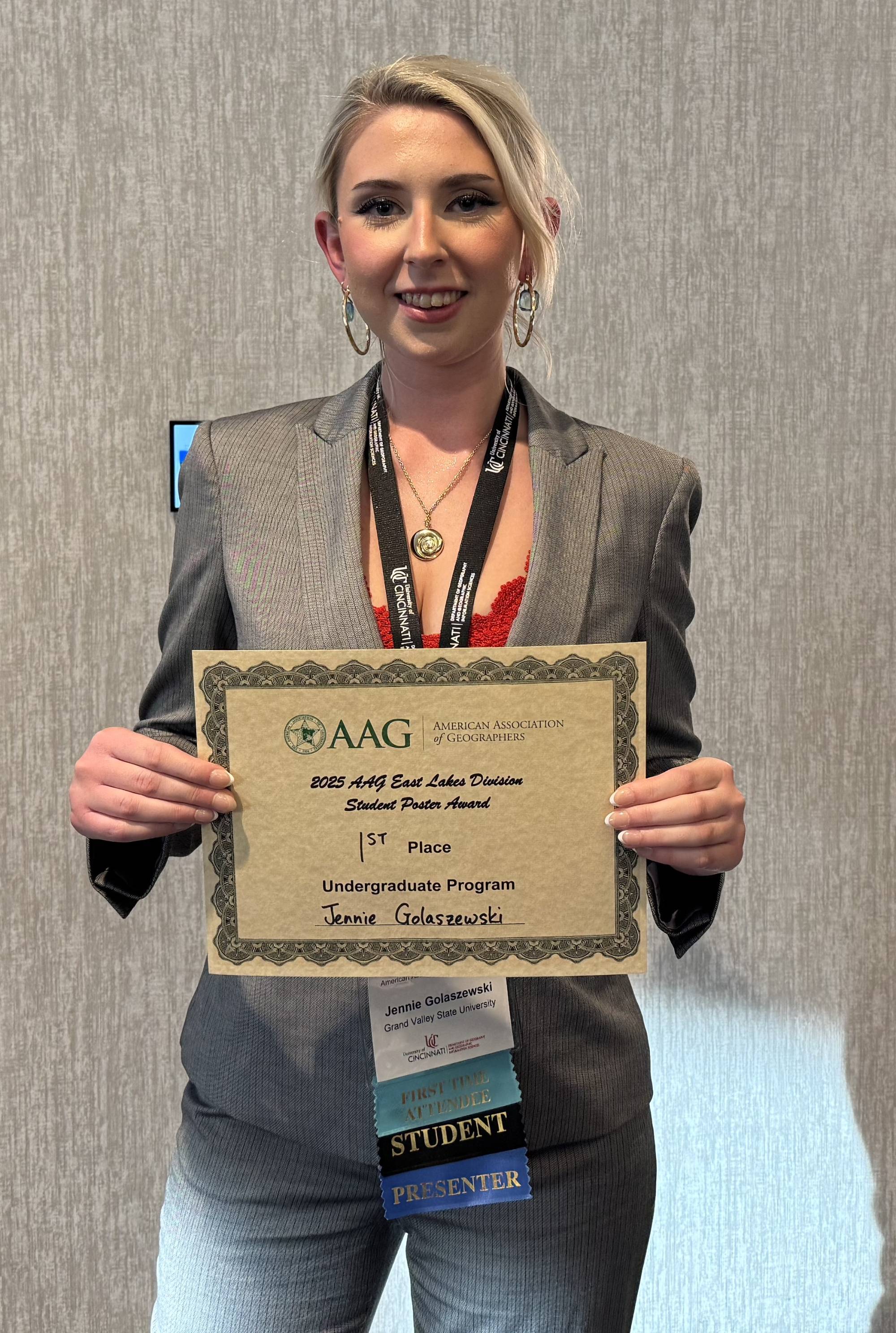 Jennie Golaszewski holding her award